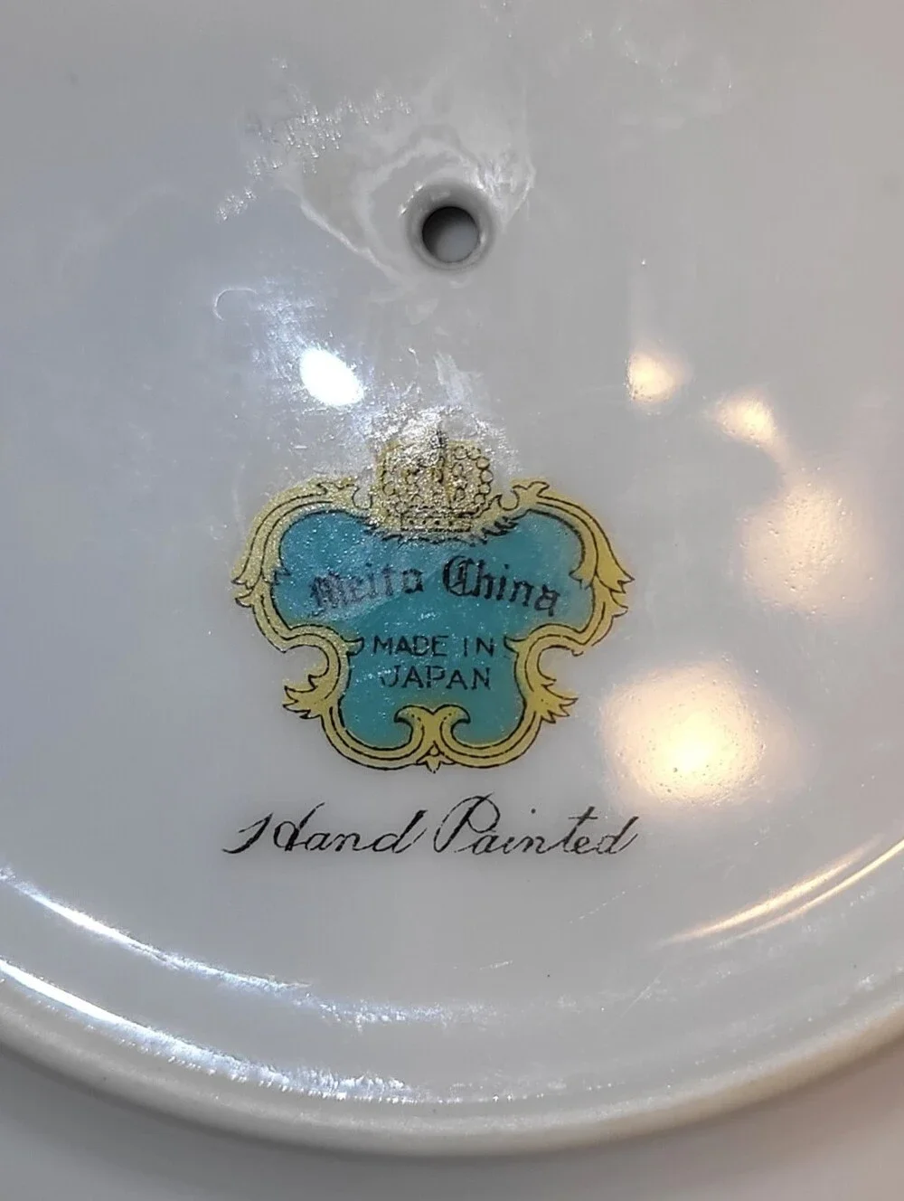 Meito China Hand Painted Porcelain Floral Gravy Boat with Attached Saucer.